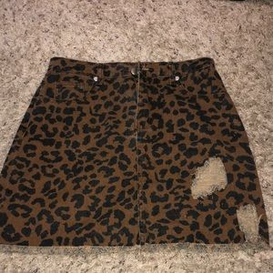 Ripped leopard print jean skirt